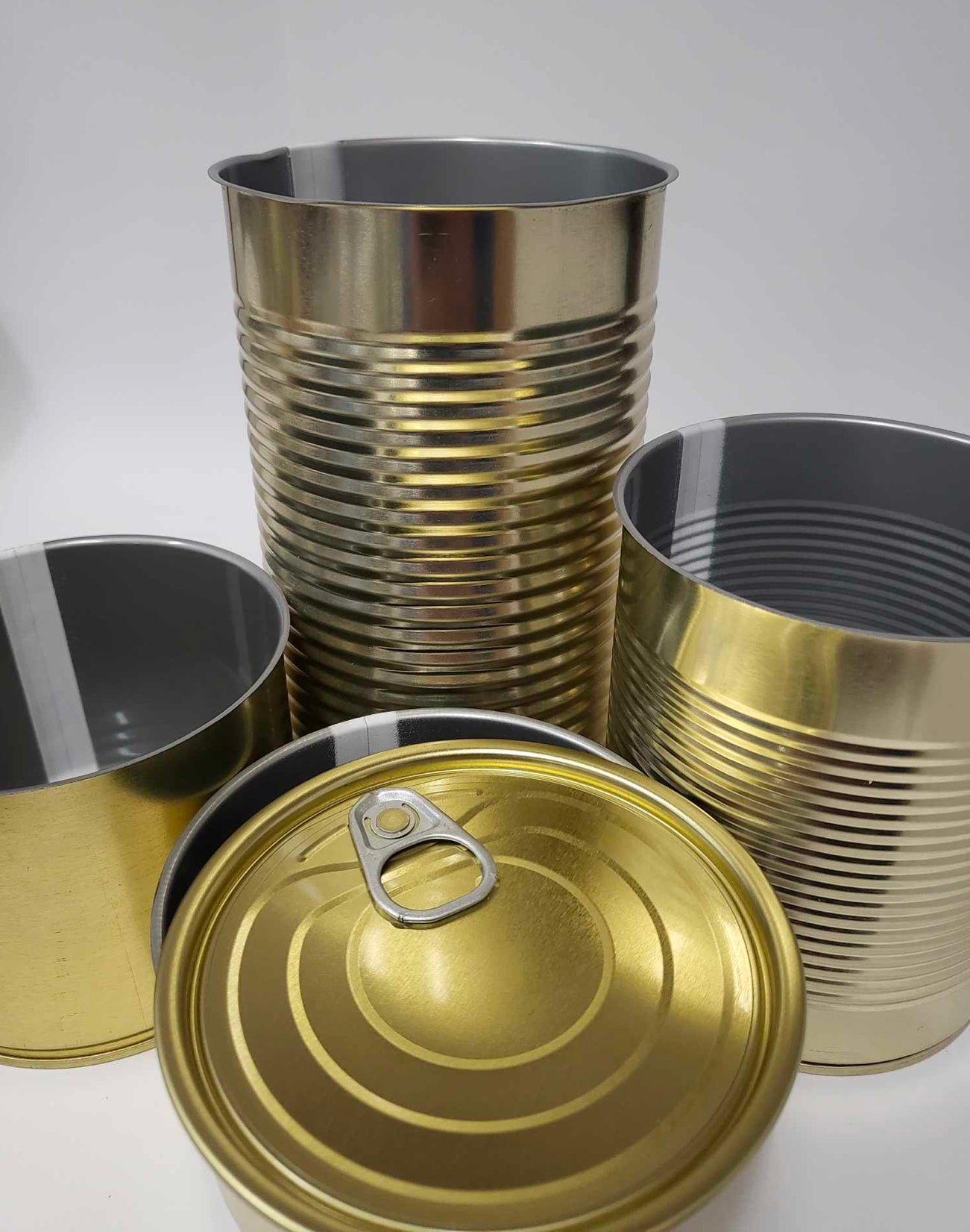 1 x Cans 99mm by 176mm Outside - gold color, inside - gray.