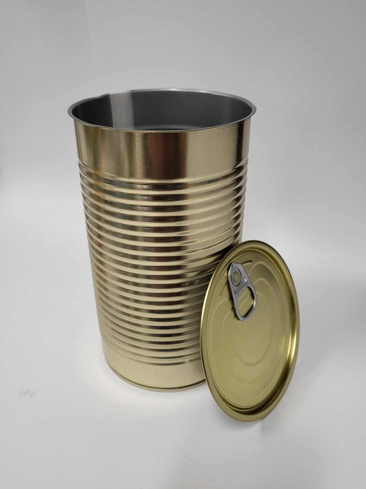 1 x Cans 99mm by 176mm Outside - gold color, inside - gray.