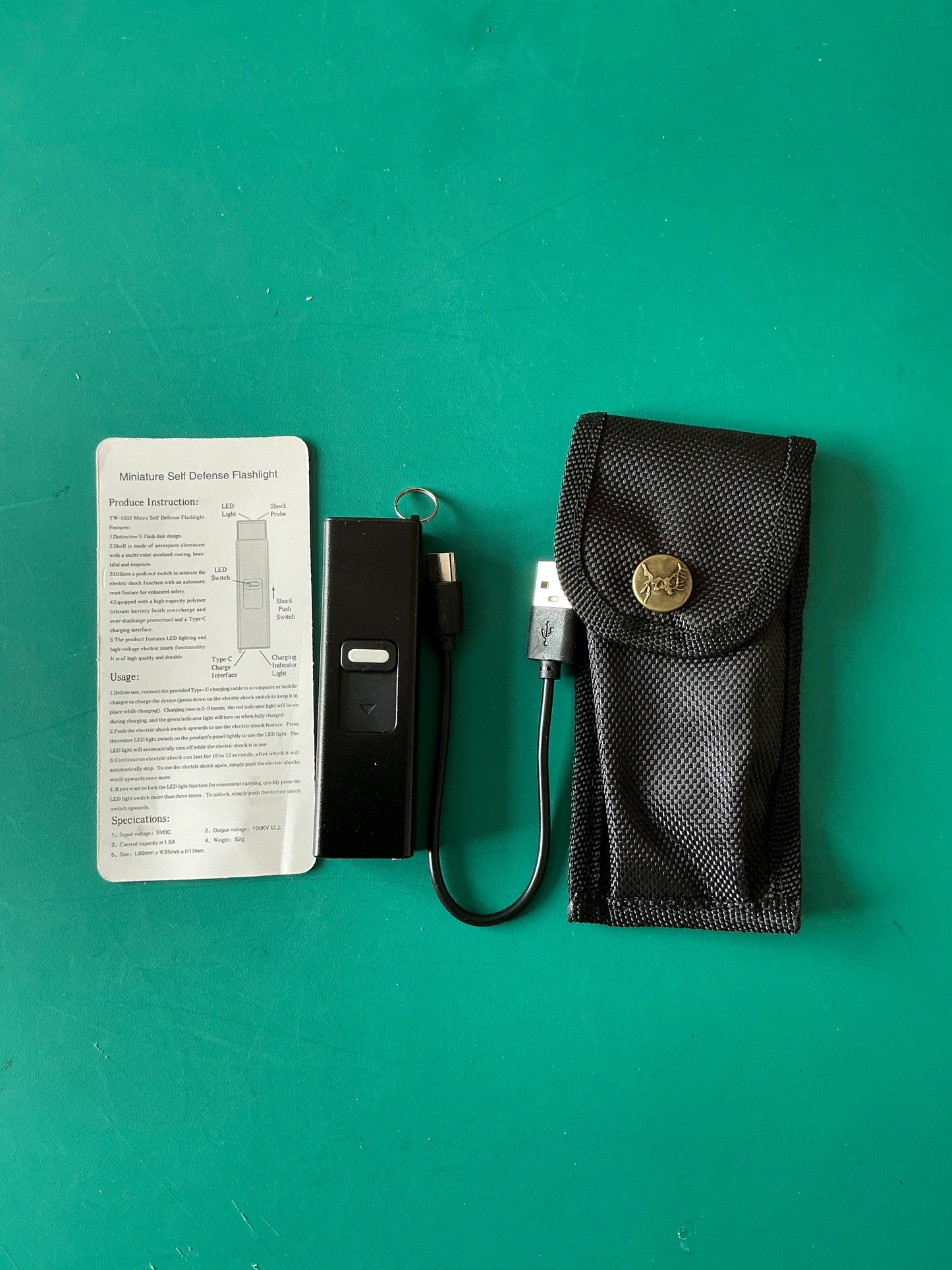 Miniature Self Defense Flashlight and an Electroshock device with a case.