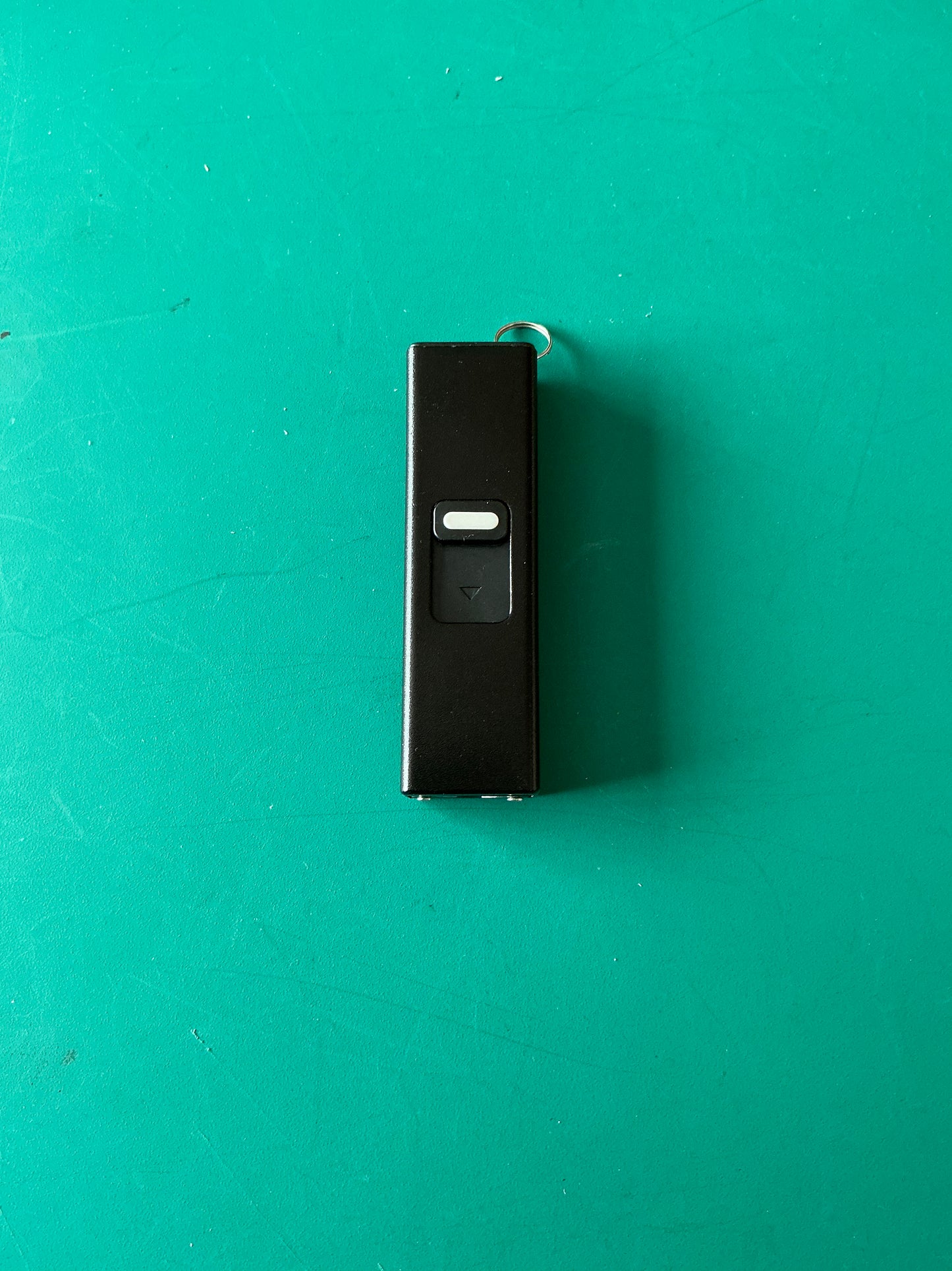 Miniature Self Defense Flashlight and an Electroshock device with a case.