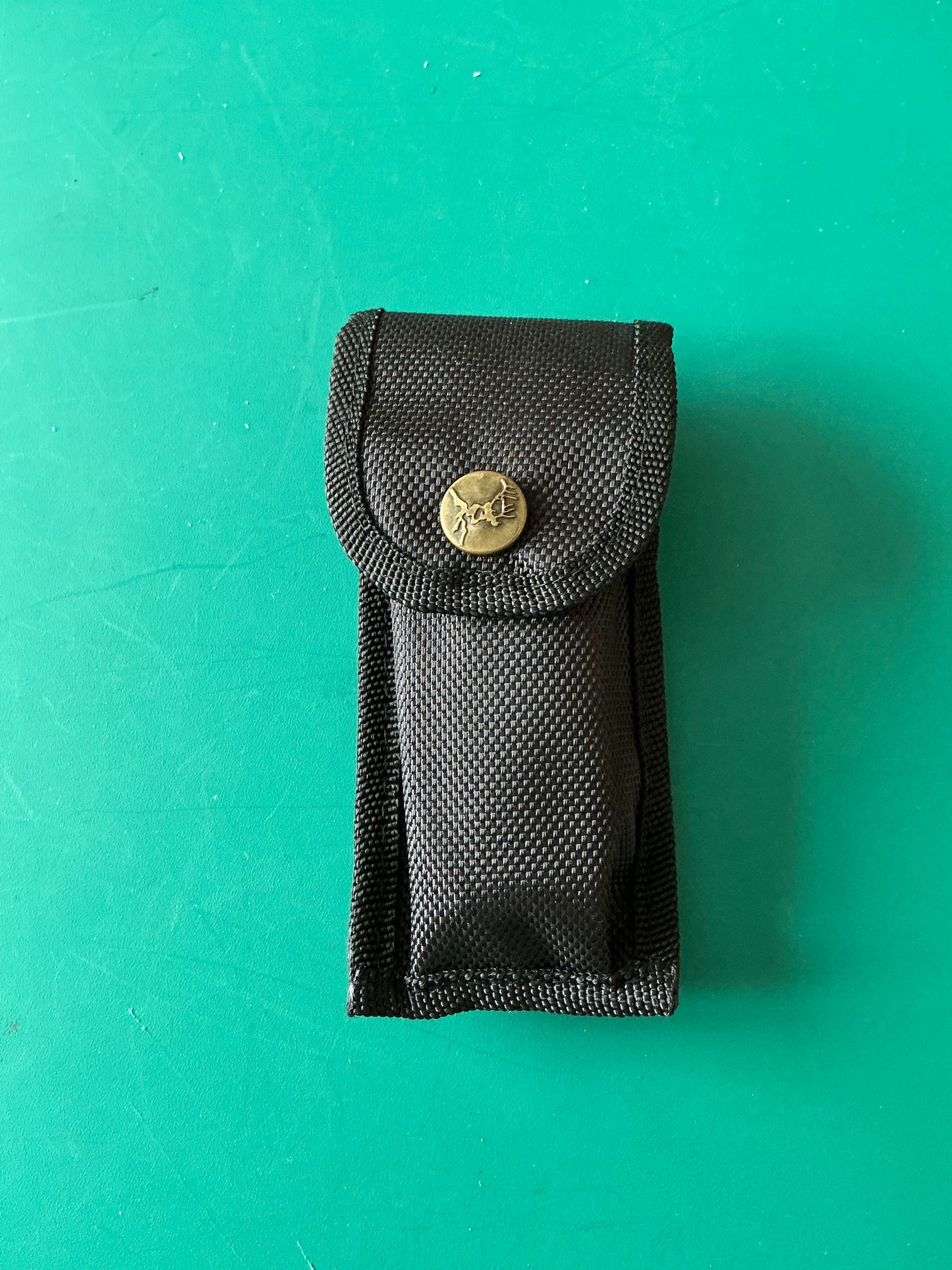Miniature Self Defense Flashlight and an Electroshock device with a case.